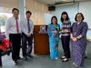 Principal Mdm Tan Lian Lian (in blue) of St. Andrew’s School presenting a souvenir to Ms Linda Lee